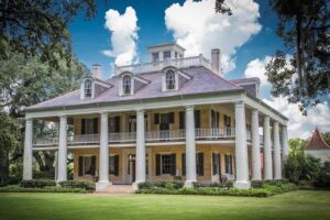 Private Louisiana Plantations Tour with Gourmet Lunch from New Orleans - Destrehan Plantation on Old River Road: Greek Revival with people at the center