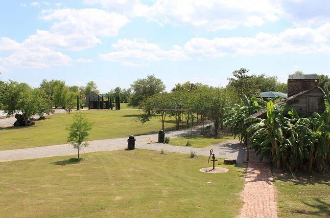 Whitney Plantation Tour with Transportation - Inside Whitney Plantation: cabins, artifacts, fields, and a chapel that matters